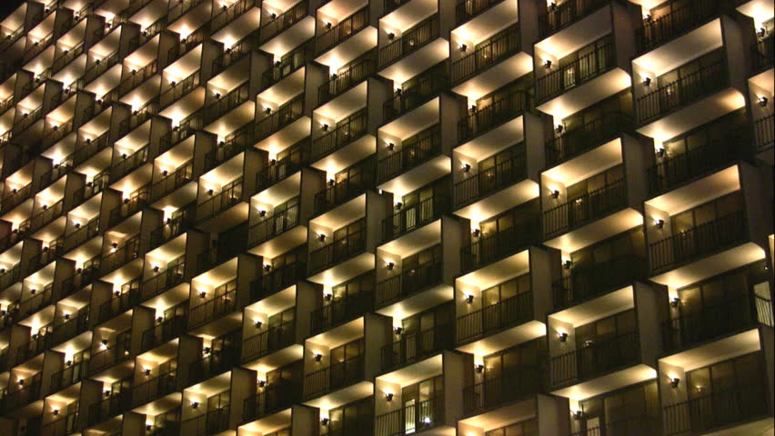 Video of hotel balconies at night. Abstract appearance because of lights and design. San Antonio Texas riverwalk area. Optical illusion.