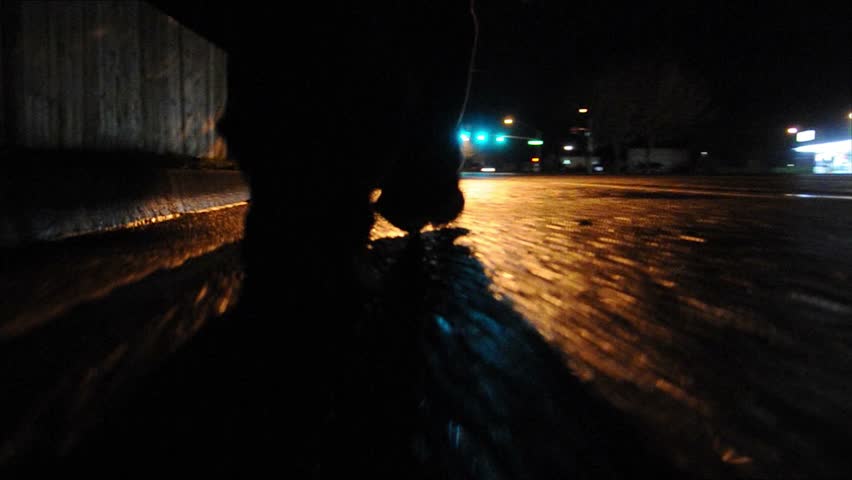 Walking alone down the street at night - low camera angle