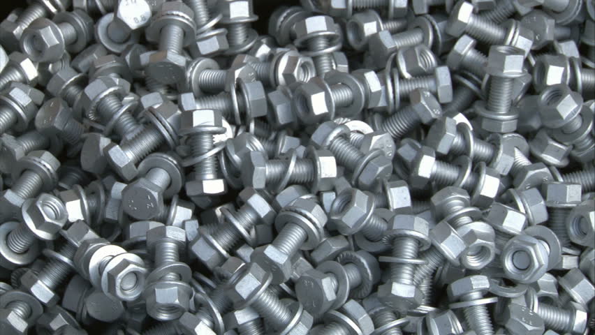 Pre-assembling screws with nuts for solar power plant panels.