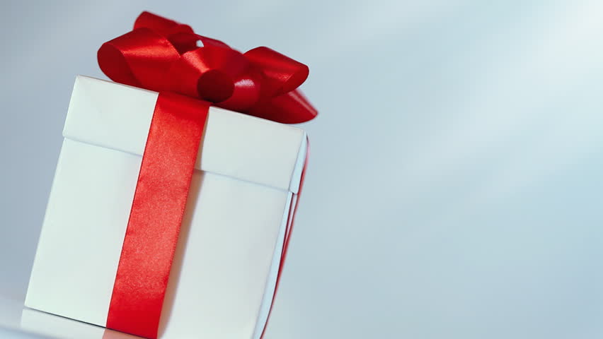 rotating gift in white box with red ribbon. HD video 1920x1080