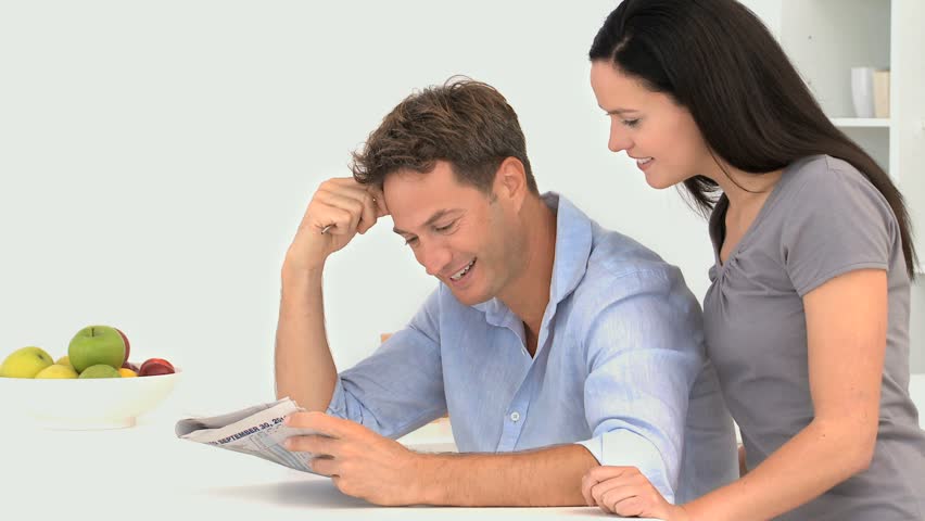 Man doing crosswords with his wife
