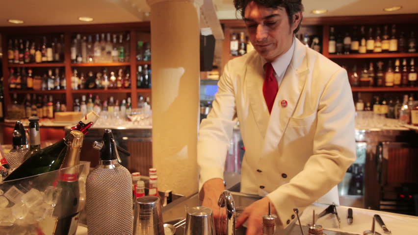 A series of model released clips featuring a male cocktail waiter in a classic looking cocktail bar in barcelona, Spain