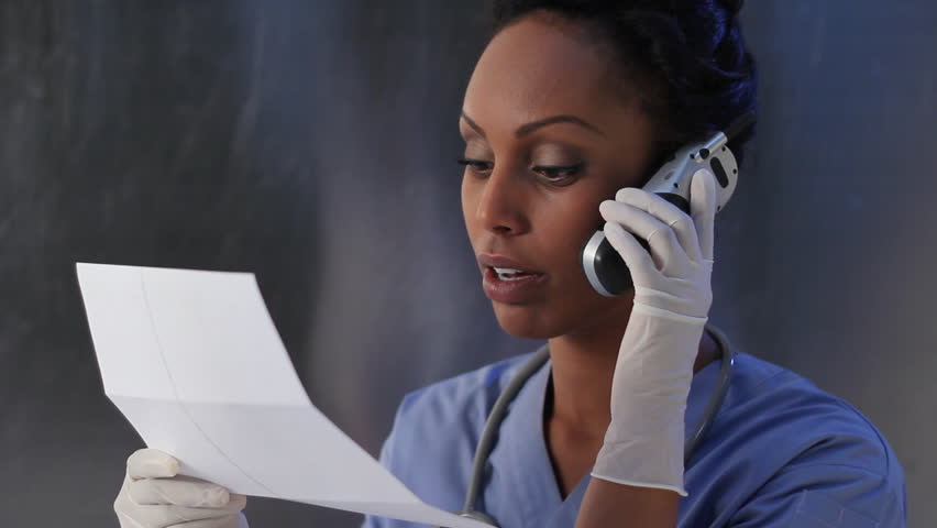 Nurse And Big Needle Female Nurse Holds Up Big Needle Shallow DOF