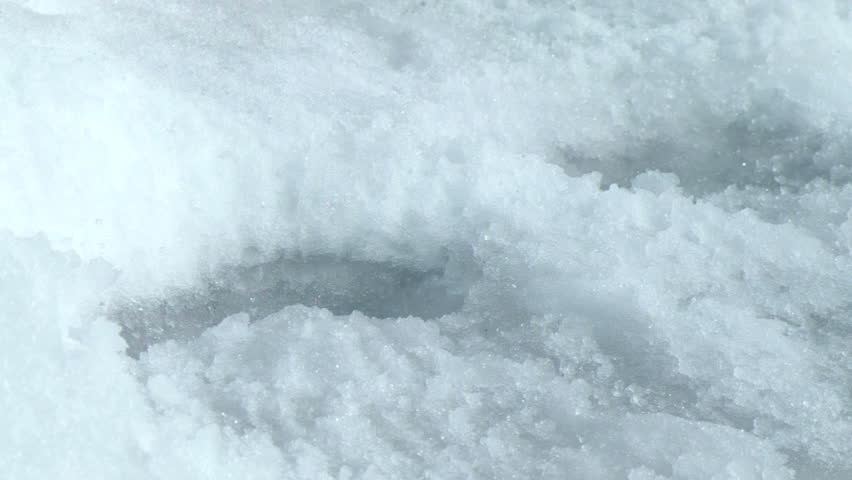 Water droplets, which appeared due to abundant snowmelt drain into the pond. Beautiful sprays are emitted in different directions. Subjects on the specifics of the spring season.