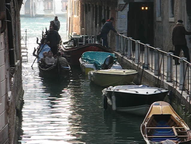Venice: Gondola passage along an unknown canal