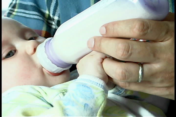 Father feeding baby