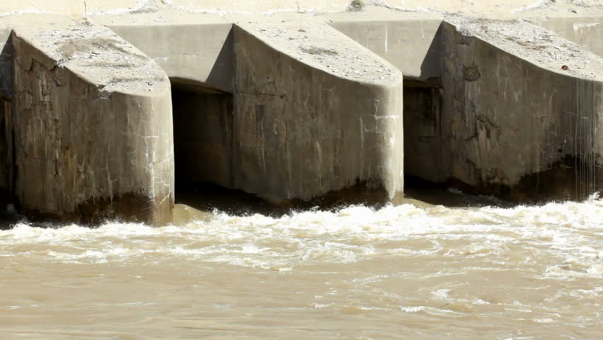 Bottom of Dam with water rushing out
