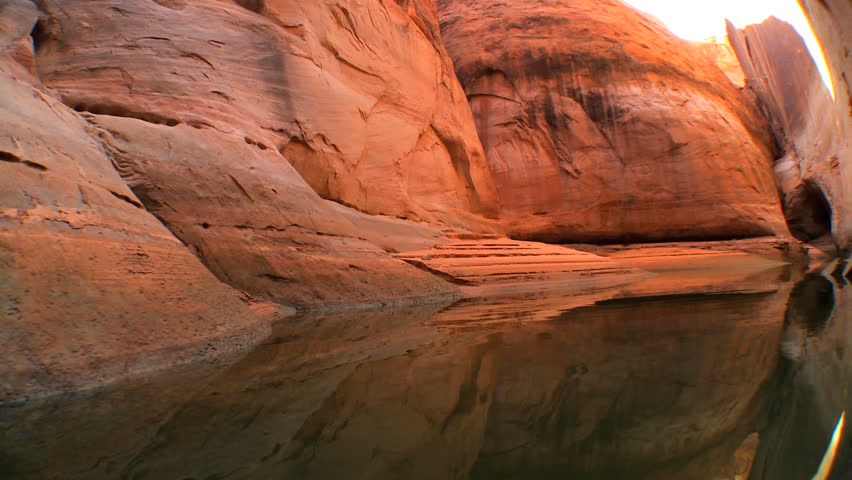 Traveling through the canyons of Lake Powell and its layers of sandstone rock