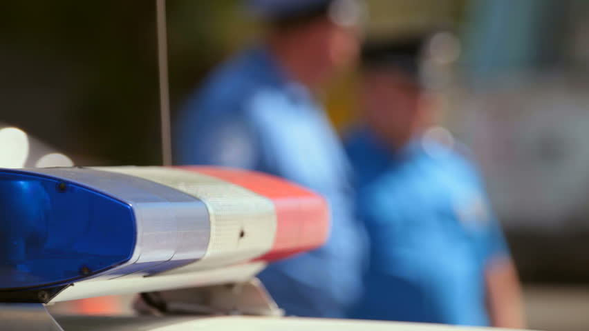 police car on city road in the background cop