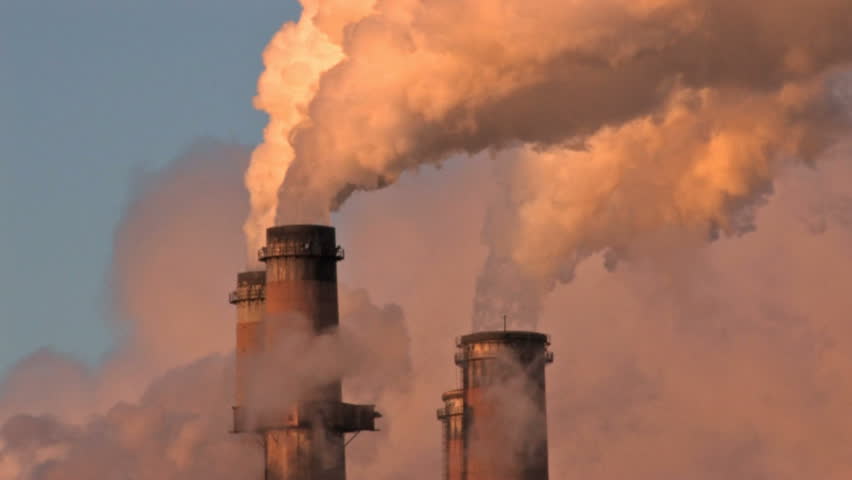 Pollution, smoke and steam discharged from a coal powered electrical generation facility in New Mexico. Contamination, pollution causing global warming and climate change. 