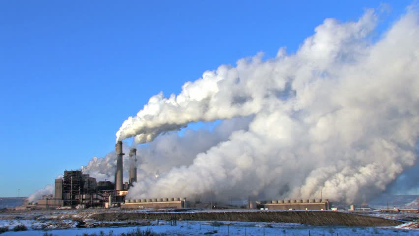 Pollution, smoke and steam discharged from a coal powered electrical generation facility in New Mexico. Pollution contamination, pollution and global warming and climate change. 