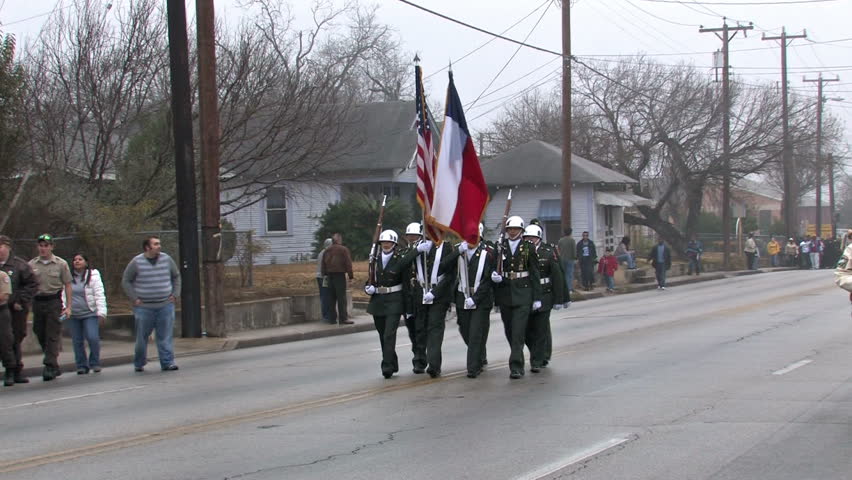 Video of ROTC Honor Guard with flags in the largest Martin Luther King MLK March in the USA in San Antonio, Texas.  Editorial. 