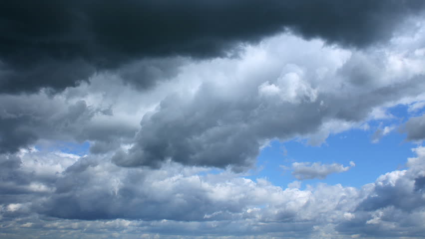 Fast running clouds in the blue sky.