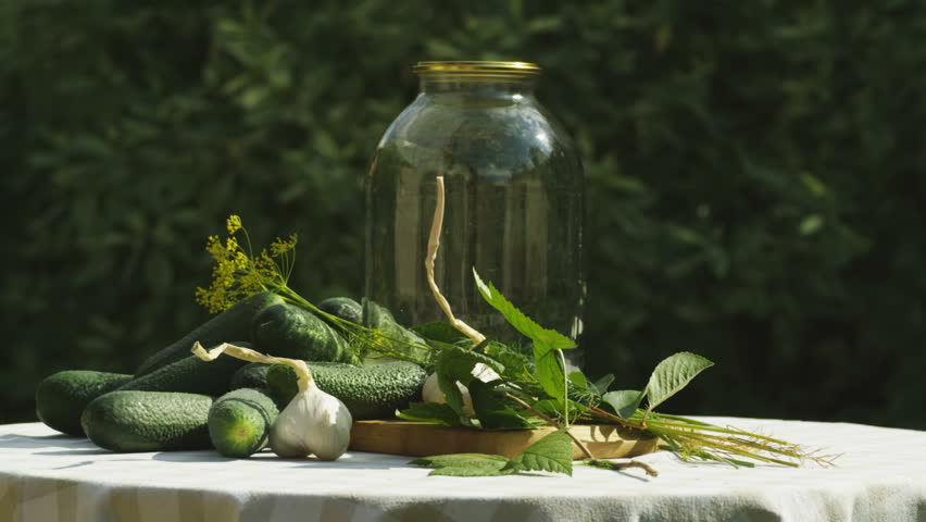 Composition with cucumbers to be canned.