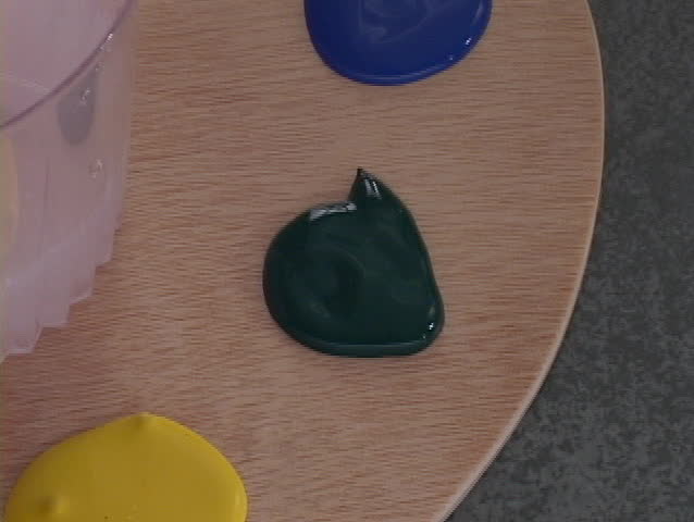 Brush dabs paint moves to canvas