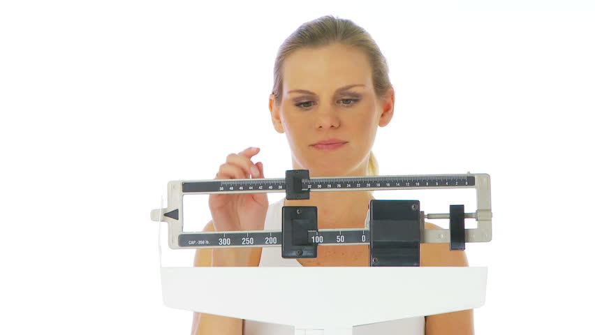 Upset woman on scale
