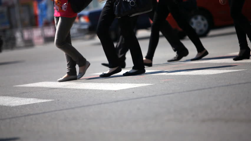 People crossing street. Crowded crosswalk. City life