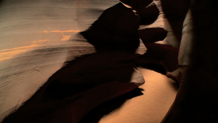 Tracking shot moving through environmental rock formations underground