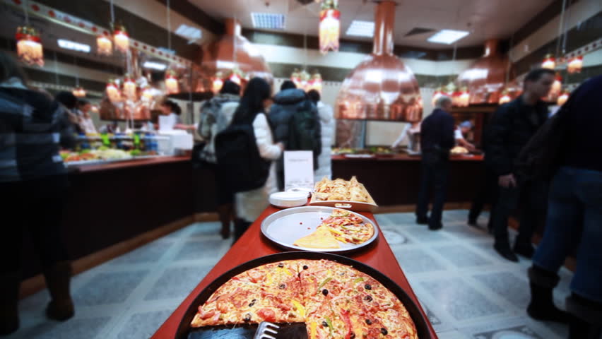 tasty italian pizza in cafe where sells lot of good food, close-up