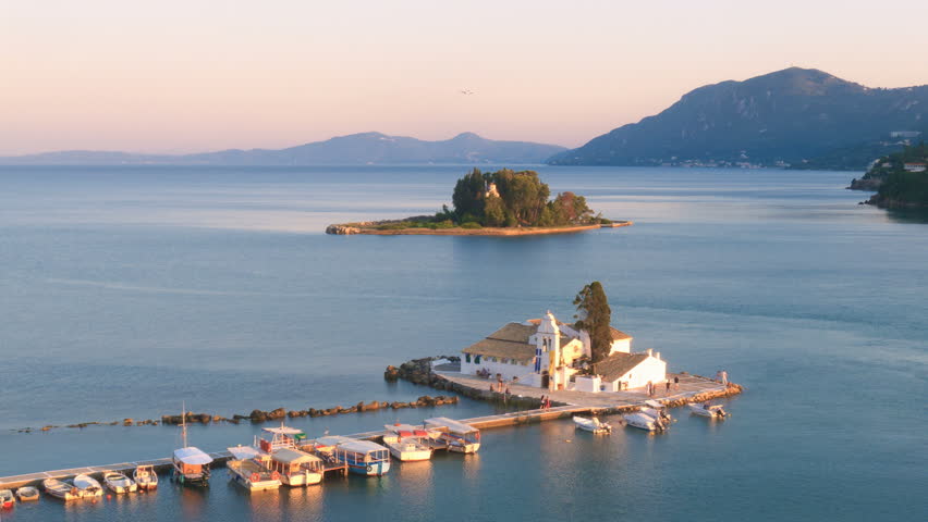 Time-lapse: aerial view of of Vlacherna monastery before sunset, Kanoni, Corfu, Greece 