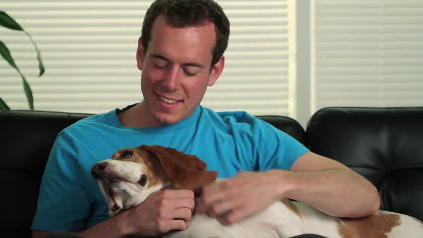 Happy man petting his dog