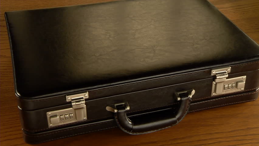 Briefcase filled with US currency, opens and closes