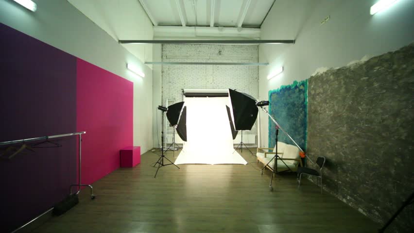 Fly through photo studio between spotlights to white background