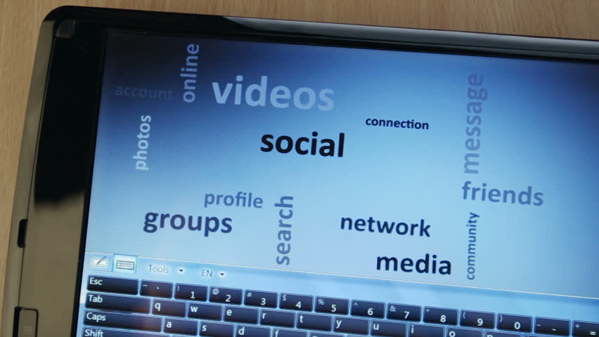 social network on touch-screen tablet-pc with finger touching screen and arranging words