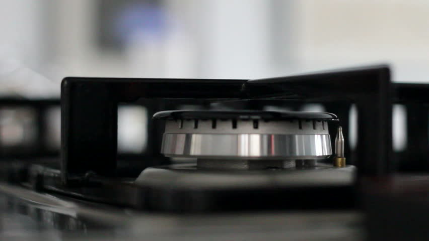 A Fire burns on the stove of a Modern Kitchen