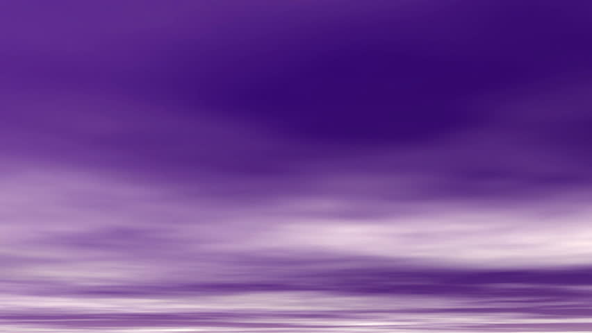 White clouds float over, through a purple sky.