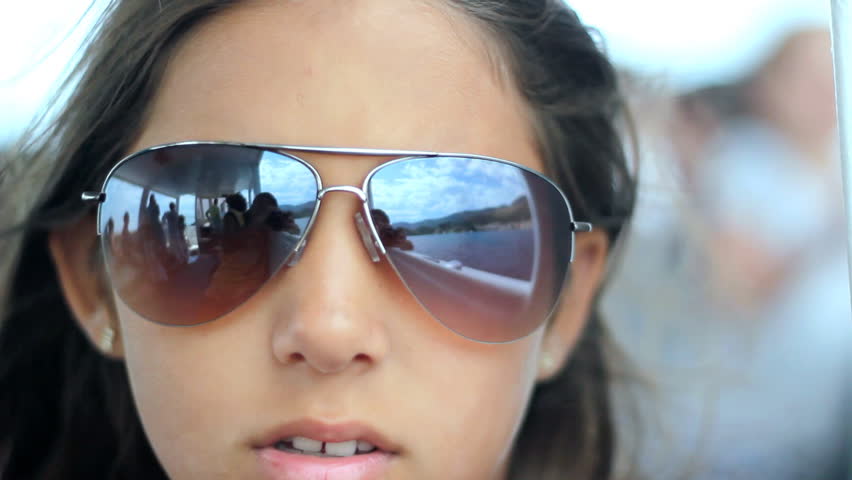 Close up of girl's face wearing sunglasses. HD 1080i. 
