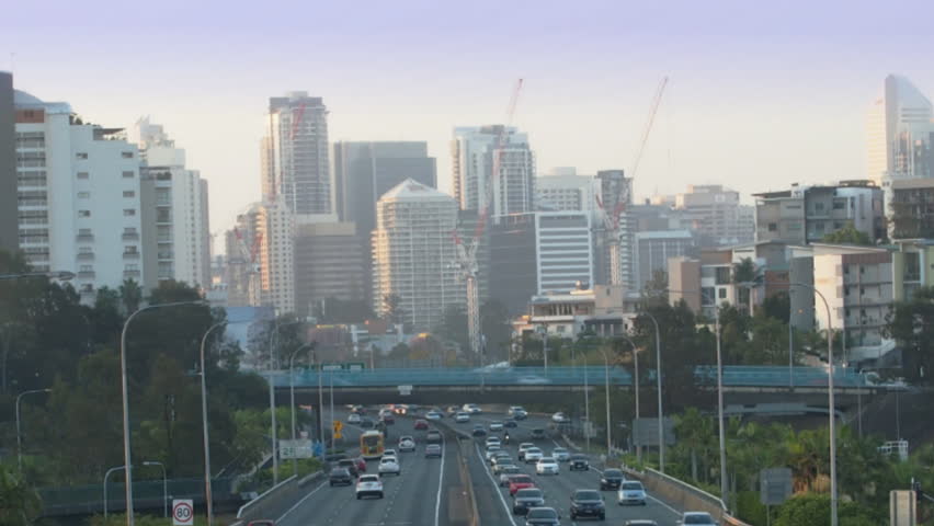 City freeway in timelapse. Day to night. (Zoom from CBD)
