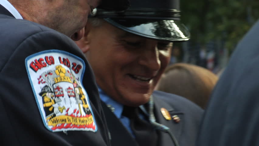 NEW YORK - SEPT 11: Firefighters converse during a ceremony at the Firefighters Memorial on September 11, 2011 in New York. Firefighters from around the world attended on the 10TH anniversary of 9/11.