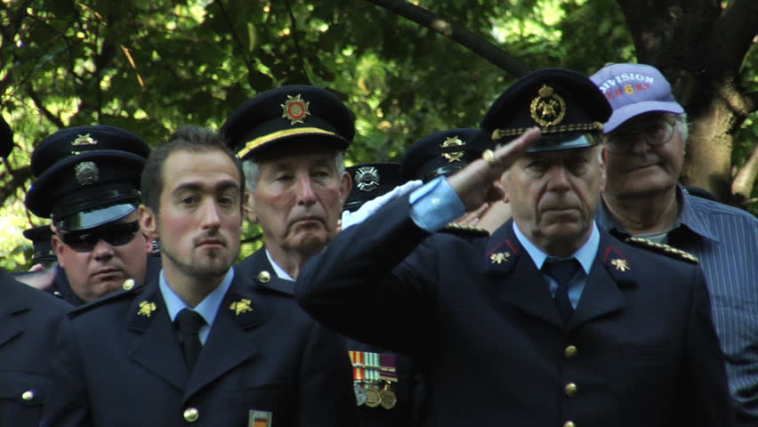 NEW YORK - SEPT 11: Firefighters salute during a ceremony at the Firefighters Memorial on September 11, 2011 in New York. Firefighters from around the world attended the ceremony.