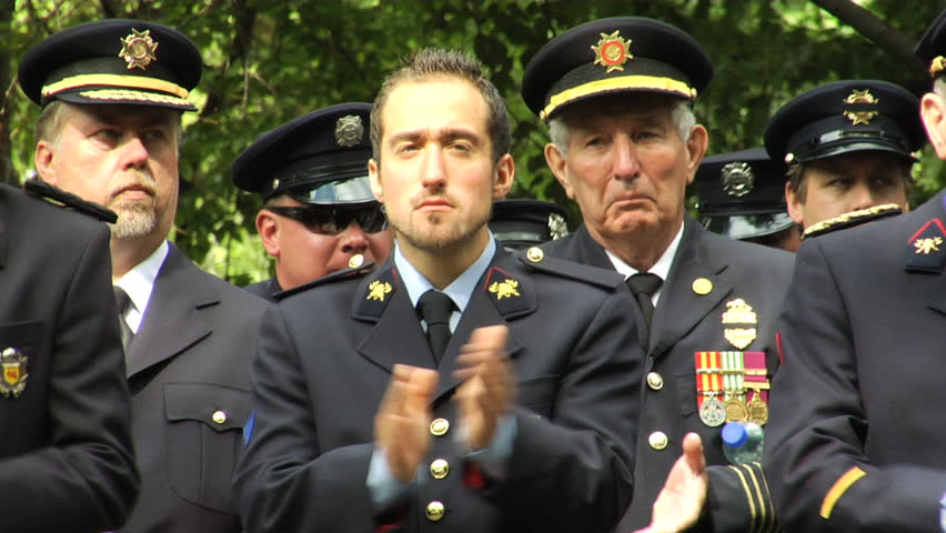 NEW YORK - SEPT 11: Firefighters applaud during a ceremony at the Firefighters Memorial on September 11, 2011 in New York. Firefighters from around the world attended the ceremony.