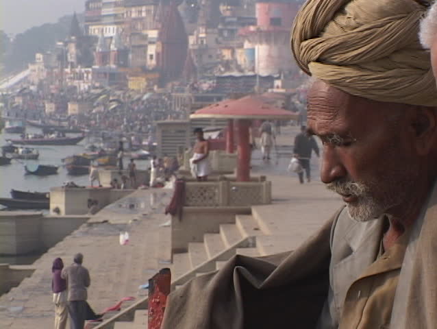 VARANASI, INDIA - CIRCA 2010: An Indian mystic, also known as a wise man or guru, sits beside gnats in circa 2010 Varanasi, India.