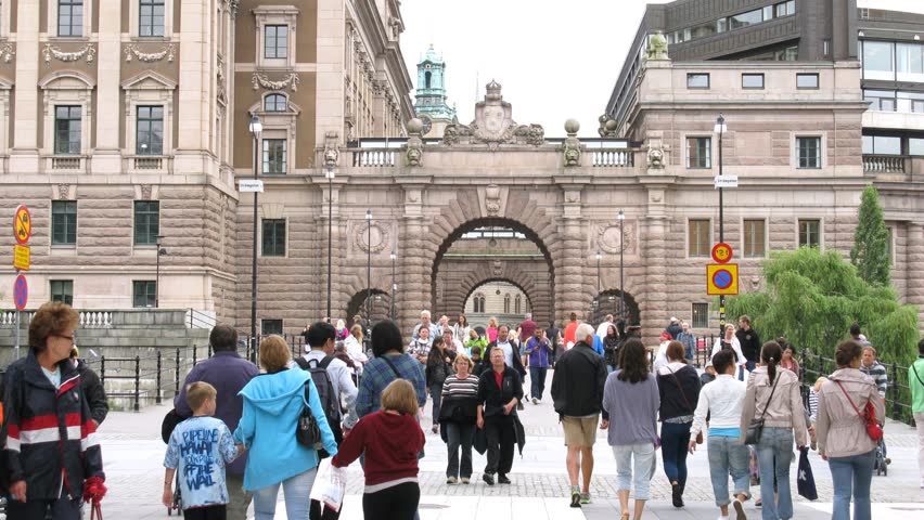 STOCKHOLM, SWEDEN - JULY 15: People pass front of Riksdag on July 15, 2011 in Stockholm, Sweden. The Riksdag (officially Swedish: Sveriges riksdag) is the national legislative assembly of Sweden. 