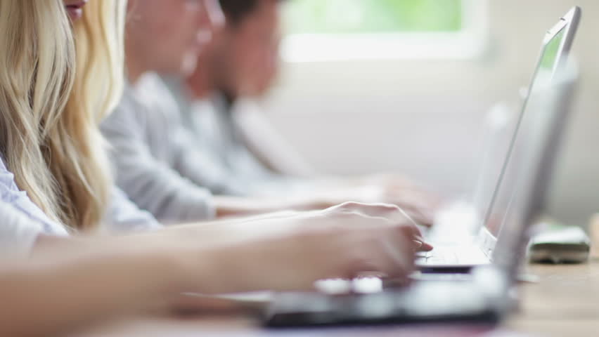 College students in university typing on their computers