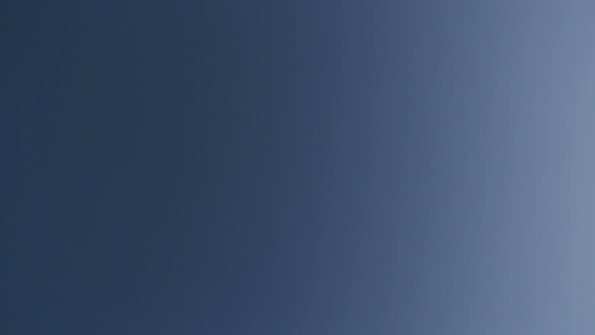 HD footage of a twin engine jet plane passing overhead, horizontally across the frame, with included jet engine noise