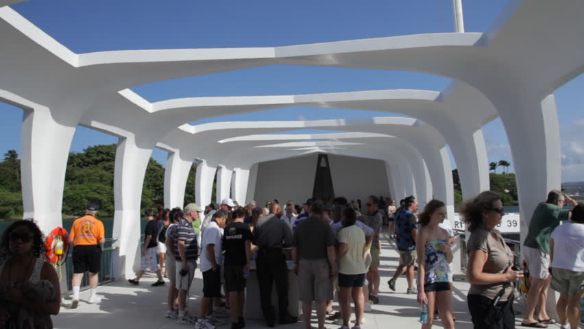 PEARL HARBOR, HI - MAY 27: (Edited Sequence) People enter and exit the USS Arizona Memorial on May 27, 2011 in Pearl Harbor, Oahu, Hawaii, USA. The memorial, dedicated in 1962, is visited by more than one million people annually.
