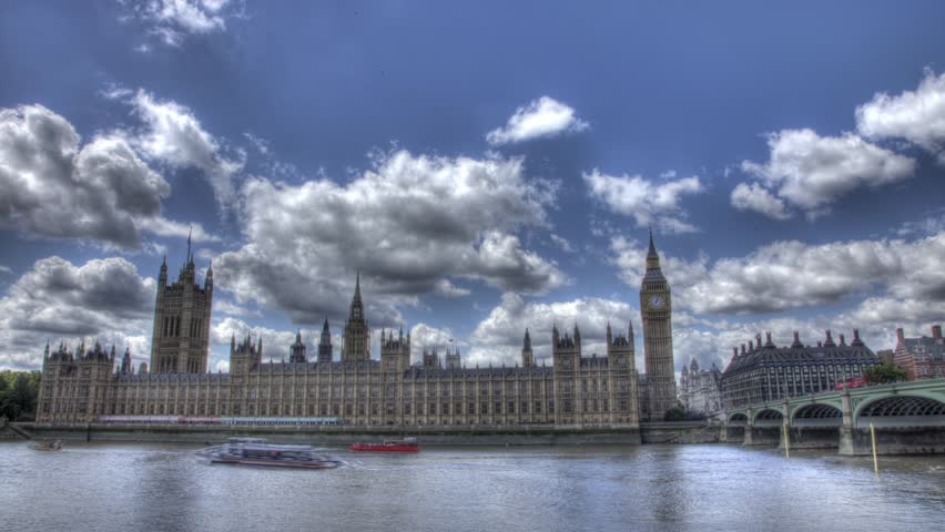  HDR (High Dynamic Range) time lapse of Big Ben and the River Thames in the day time as boats zip by and clouds roll in July 2011 in London.
