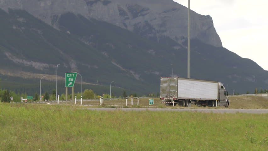 Follow pan of semi-trailer truck