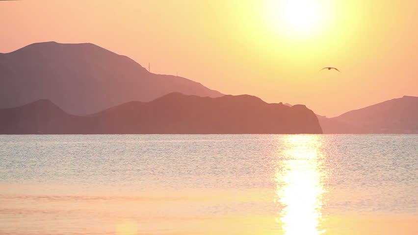 Sailing boat in the sea at sunrise 