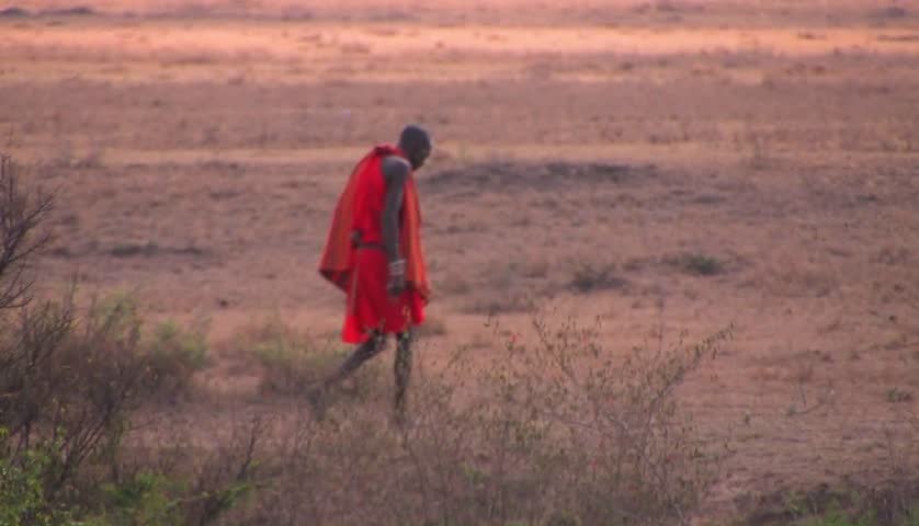 KENYA, AFRICA - CIRCA 2009: A tribesman walks across savannah circa 2009 in Kenya.