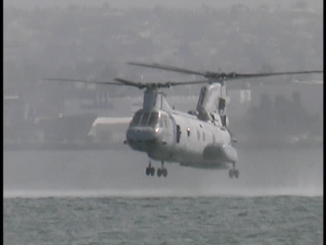 Marines jumping out of a helo
