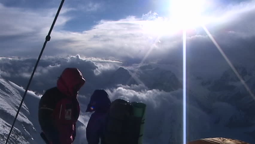 MOUNT EVEREST, TIBET - CIRCA 2005: Climbers next to tent high on Everest circa 2005 in Tibet.