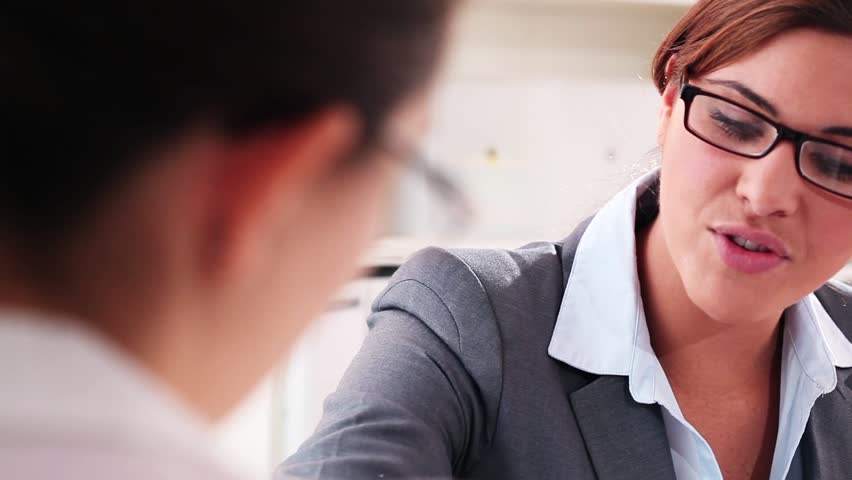 Successful meeting between two pretty young professional woman