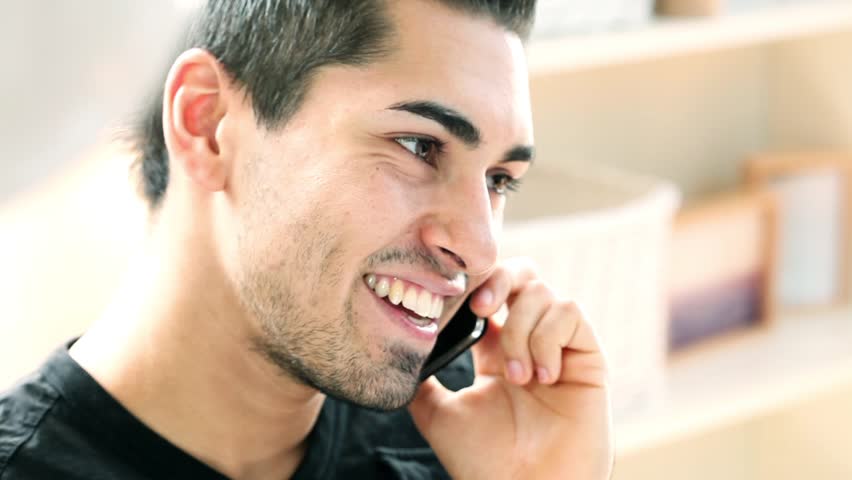 Latin american man using mobile phone