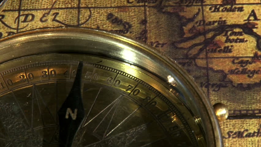 Golden compass and ancient map, zoom