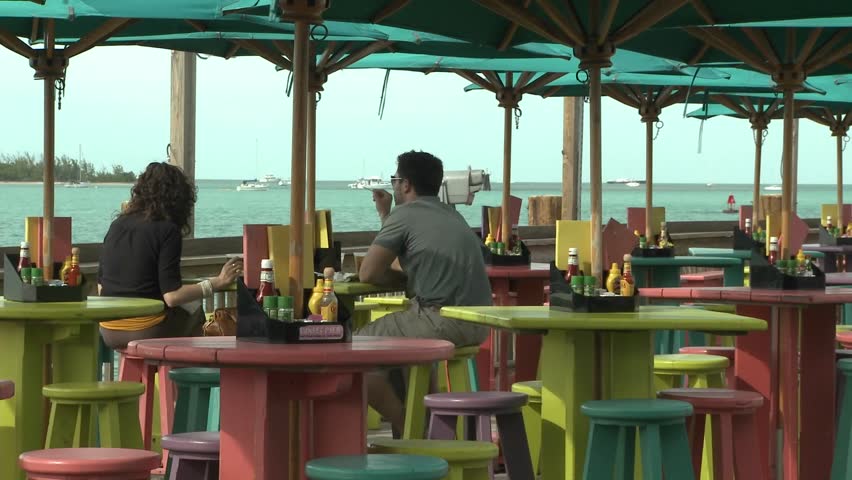Couple about to dine daytime with an ocean view